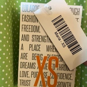 Green LulaRoe maxi dress with white polka dots.